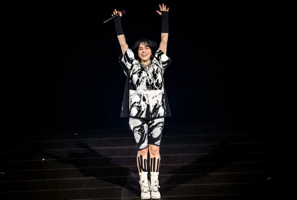 Billie Eilish UK Tour 2025 Billie Eilish performing on stage during her UK "Hit Me Hard and Soft" tour 2025 at a live concert.