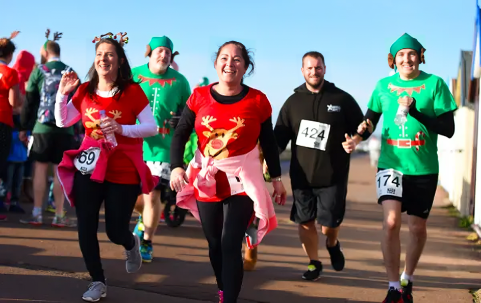 Join the Christmas Day Cracker Run and get active this holiday season Runners participating in the Christmas Day Cracker Run along the Thames.
