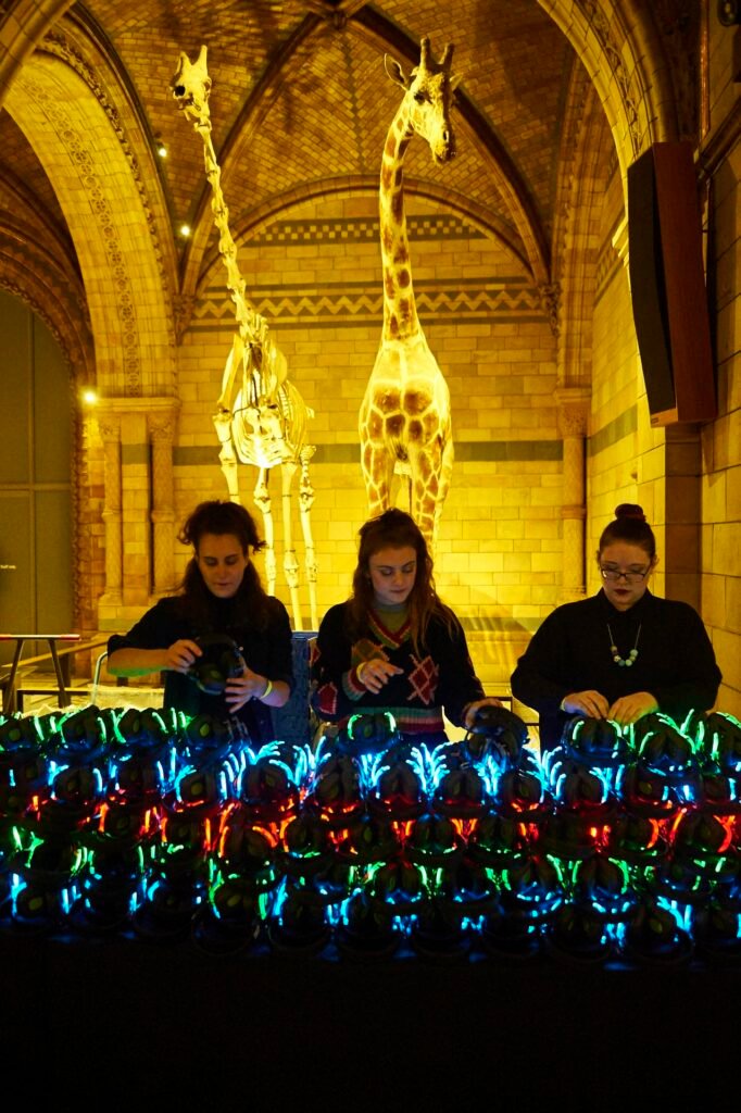 Three DJs battling it out at the Silent Disco party in London at the Natural History Museum Three DJs performing at the Silent Disco party in London at the Natural History Museum.