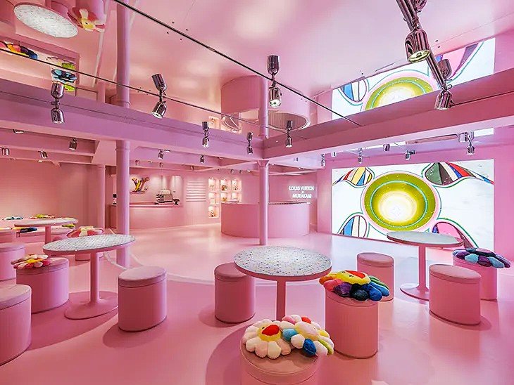 Interior view of the Louis Vuitton x Murakami pop-up café in Soho, London, with colorful designs and exclusive art-inspired décor. Interior view of Louis Vuitton x Murakami pop-up café in Soho, London, showcasing colorful décor and Murakami-themed designs