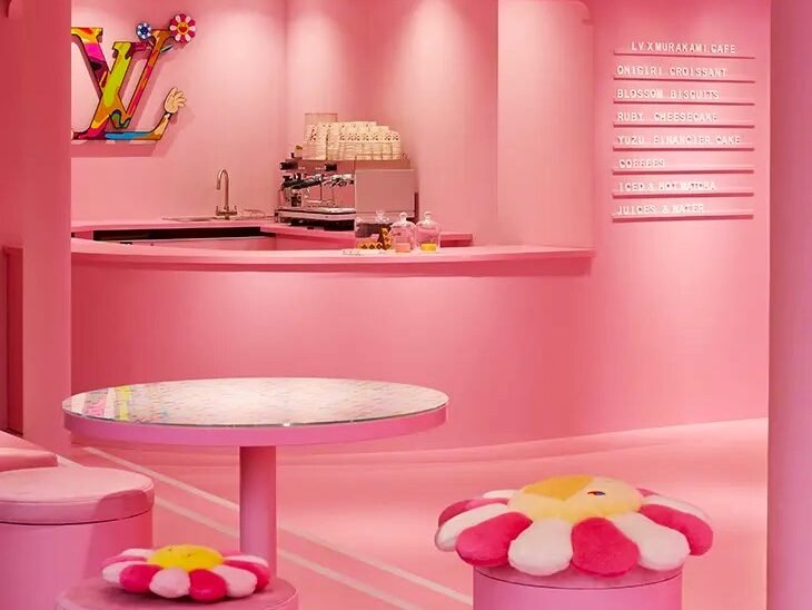 Interior view of Louis Vuitton x Murakami café, showcasing colorful furniture and Murakami-themed decor in Soho, London Interior view of Louis Vuitton x Murakami café in Soho, London, featuring colorful furniture and playful Murakami-inspired décor