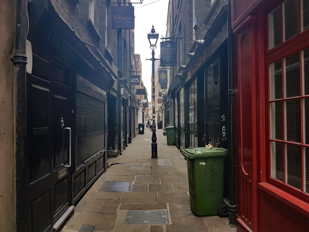 Artillery Passage London A narrow Victorian alleyway with old-fashioned shopfronts in London.