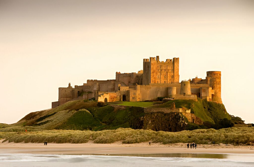 Bamburgh Castle in Northumberland, England, a historic fortress with stunning sea views. Majestic Bamburgh Castle overlooking the Northumberland coastline in England, UK