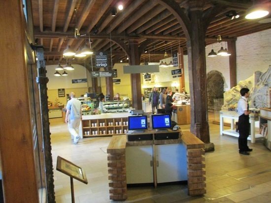 Coffee at the Tower of London – A Historic Experience A cozy café inside the Tower of London with a view of the historic fortress and River Thames.