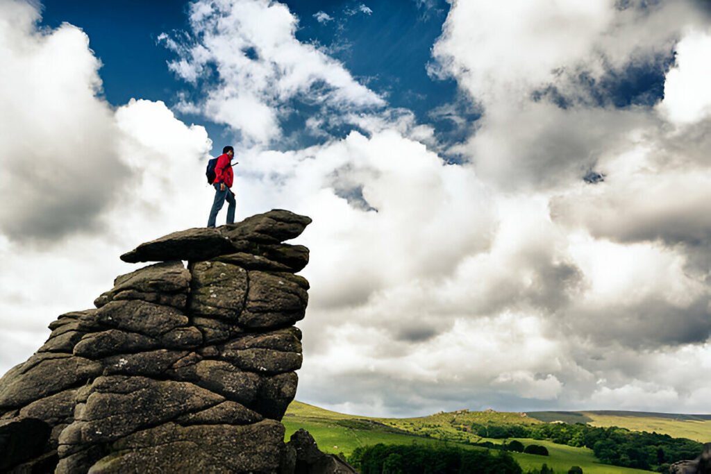 Vast open countryside at Dartmoor National Park, UK, offering over 368 square miles of scenic hiking trails and outdoor exploration. Scenic hiking trails across 368 square miles of open countryside at Dartmoor National Park, UK.