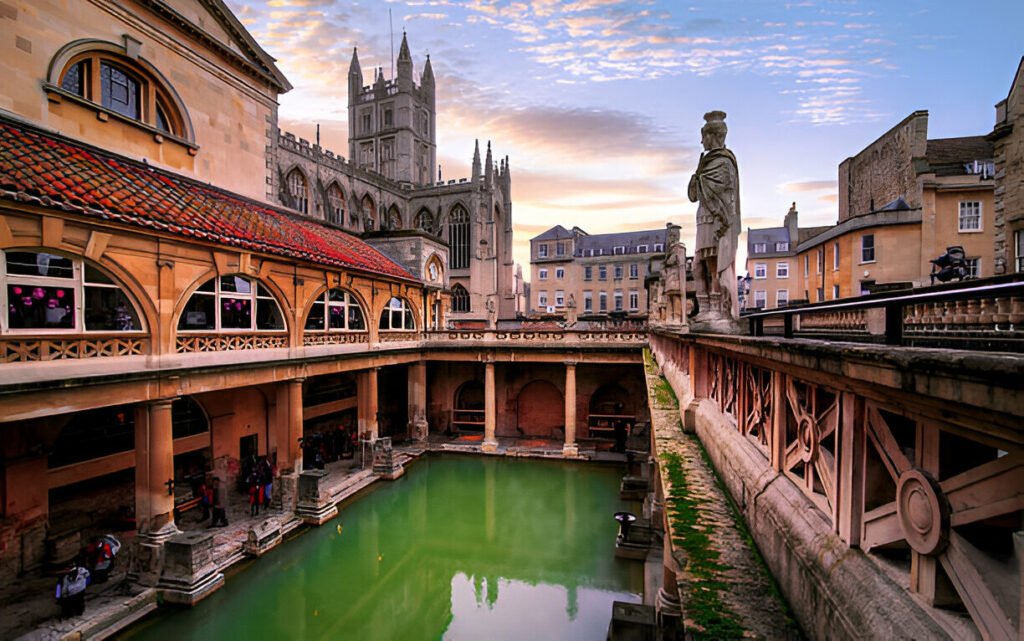 Ancient Roman Baths in Bath, UK, with natural thermal waters and historic architecture. The historic Roman Baths in Bath, UK, showcasing ancient architecture and steaming thermal waters.