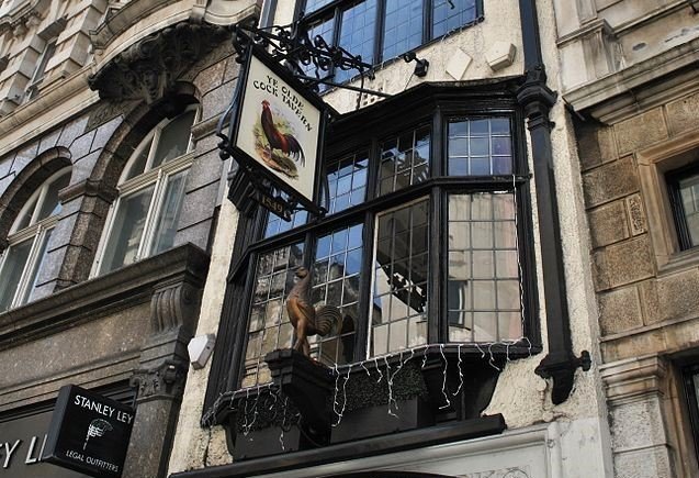 Ye Olde Cock Tavern – London’s Narrowest Pub A historic and narrow Tudor-style pub with a traditional wooden exterior