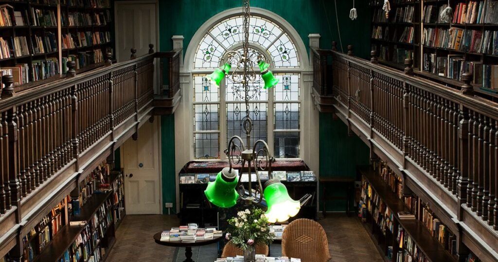 Daunt Bookshop – Best Places to Visit in London | HouseToMotive Inside Daunt Bookshop, featuring wooden bookshelves and classic literature – A good place to visit in London for book lovers