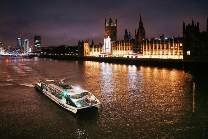 Hop On a Boat on the Thames Best Places to Visit in London HouseToMotive A scenic boat ride on the River Thames, passing under Tower Bridge – A good place to visit in London.