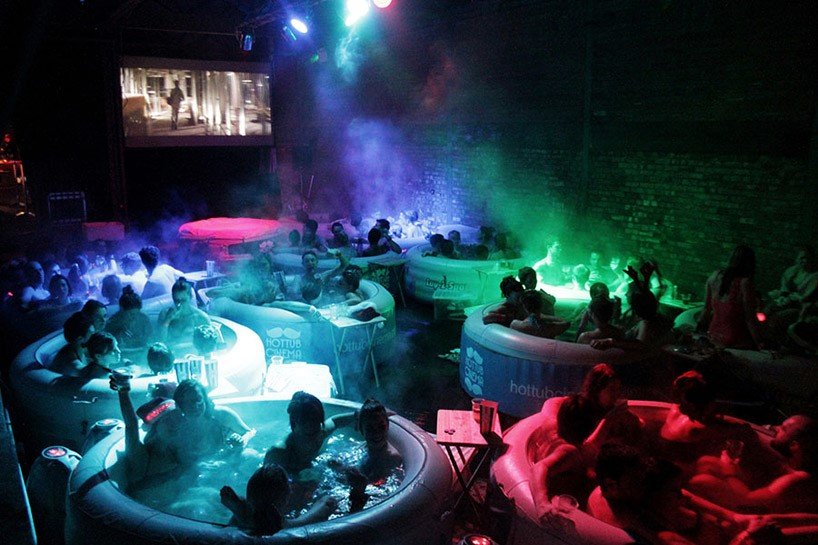 Hot Tub Cinema - Best Places to Visit in London - HouseToMotive A group of people enjoying a movie night at Hot Tub Cinema in London.